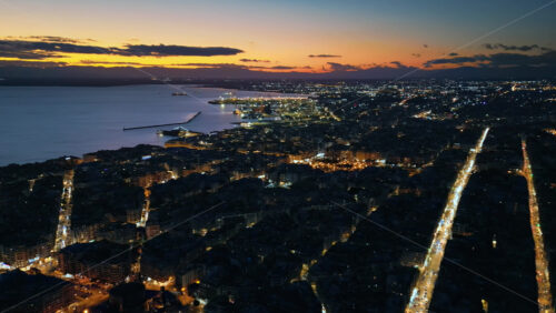 Video - Aerial drone view of Thessaloniki coastline at the sunset. The Aegean Sea in Central Macedonia in Greece