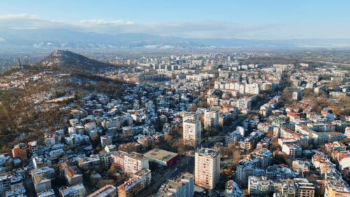 Video - Aerial drone view of Plovdiv city covered in snow. The monument of the Red Army "Alyosha" on Bunarjik Hill. Bulgaria