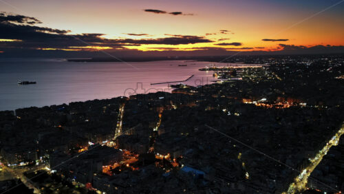 Video - Aerial drone hyperlapse timelapse of Thessaloniki coastline at the sunset. The Aegean Sea in Central Macedonia in Greece