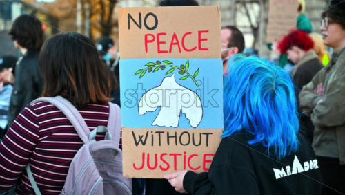 Video - Bucharest, Romania - March 02, 2024: People came out to protest with posters wishing for justice and peace
