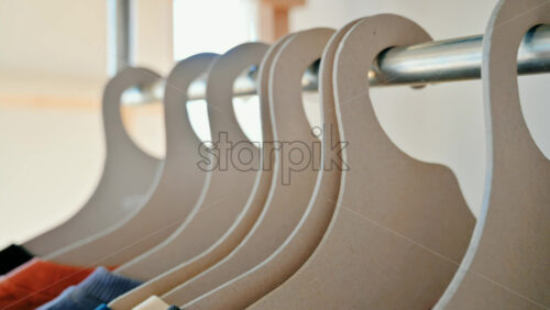 Video - Interior of an eco-friendly shop with clothes hang on brown paper hangers