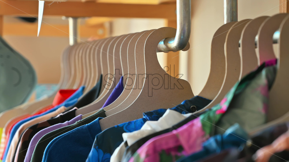 Video - Interior of an eco-friendly shop with clothes hang on brown paper hangers