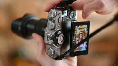 Video - Camera filming a woman drinking a glass of red wine and dancing