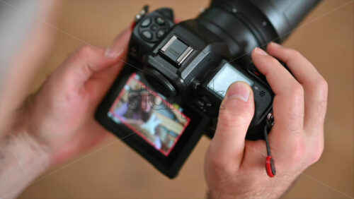 Video - Camera filming a woman petting a white bunny in the barn near square hay bales