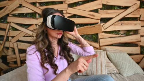 Video - Woman enjoying looking through VR headset