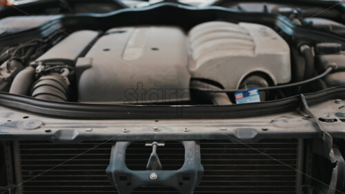 Video - Front view of a car engine compartment showcasing mechanical strength and automotive engineering