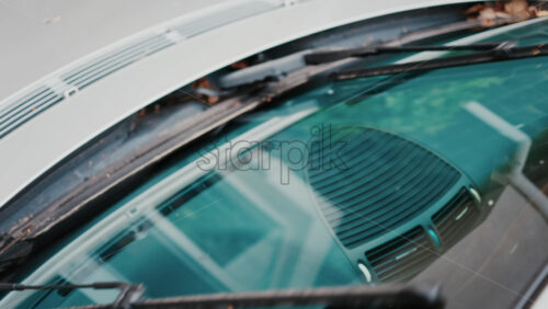 Video - Close up of windshield wipers gliding across glass, reflecting clear visibility and care