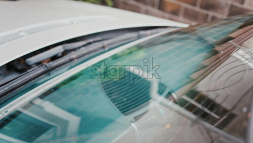 Video - Close up of windshield wipers gliding across glass, reflecting clear visibility and care