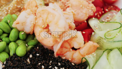 Video - Healthy shrimp bowl with tomatoes, quinoa, edamame, and zucchini