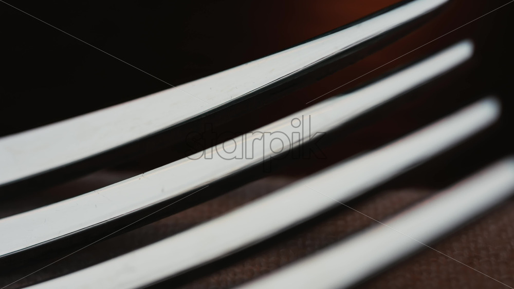 Video - Close up of fork tines with soft reflections