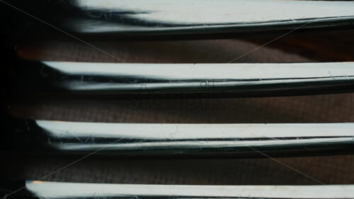Video - Close up of fork tines with soft reflections
