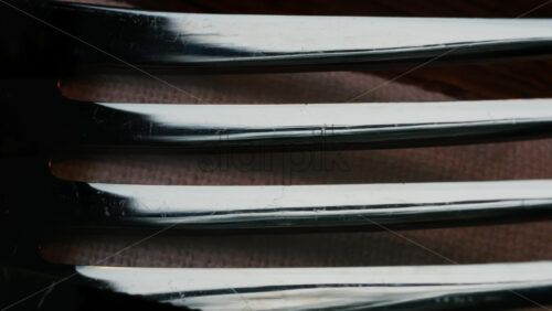 Video - Close up of fork tines with soft reflections