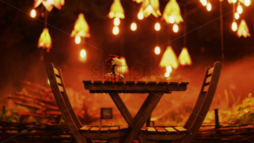 Video - A wooden table with flowers illuminated by soft hanging lights