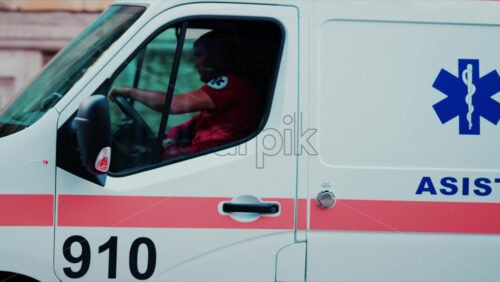 Video - Chisinau, Moldova - September 25, 2025: Emergency ambulance vehicle rushes through the city with blue lights flashing