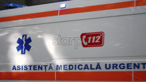 Video - Chisinau, Moldova - September 25, 2025: Modern ambulance vehicle in motion with flashing lights and medical insignia visible