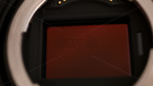 Video - Close up view of a digital camera shutter opening