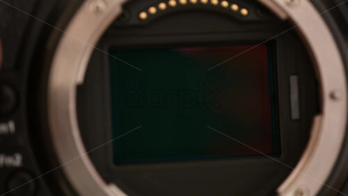 Video - Close up view of a digital camera shutter opening