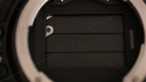 Video - Close up view of a digital camera shutter opening