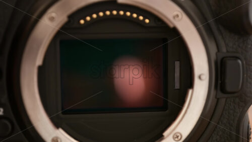 Video - Close up view of a digital camera shutter opening