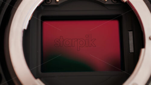 Video - Close up view of a digital camera shutter opening