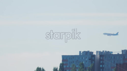 Video - Passenger airplane approaching for landing over residential buildings