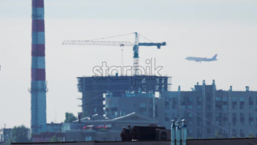 Video - Passenger airplane approaching for landing over residential buildings