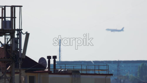 Video - Passenger airplane approaching for landing over residential buildings