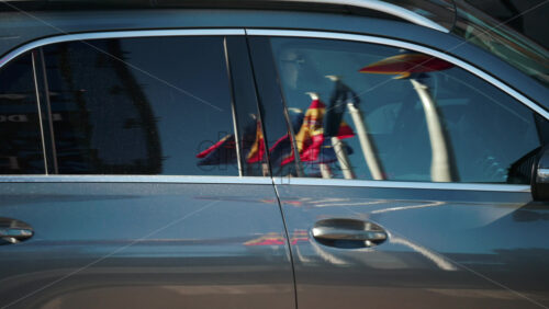 Video - Bright national Moldovan flags reflected on a shiny car door