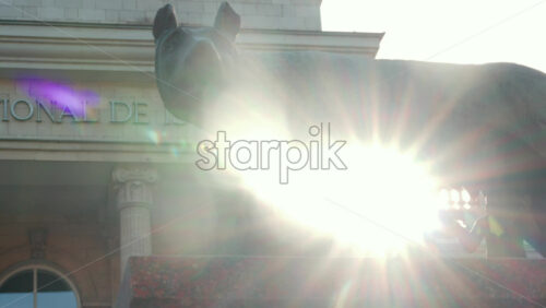 Video - Chisinau, Moldova - September 25, 2025: Historic bronze statue of the Capitoline Wolf with Romulus and Remus on a red marble pedestal in front of the National History Museum of Moldova