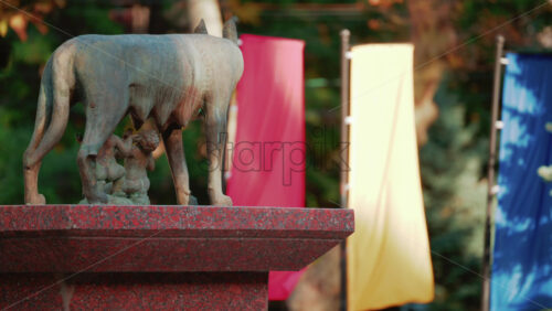 Video - Chisinau, Moldova - September 25, 2025: Historic bronze statue of the Capitoline Wolf with Romulus and Remus on a red marble pedestal in front of the National History Museum of Moldova