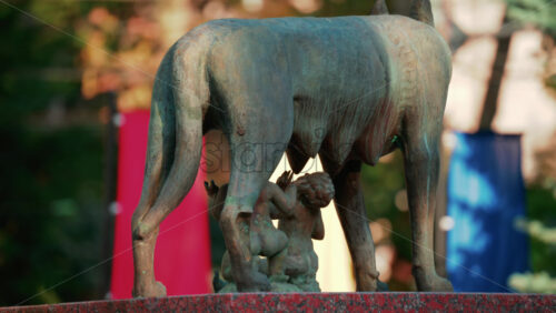 Video - Chisinau, Moldova - September 25, 2025: Historic bronze statue of the Capitoline Wolf with Romulus and Remus on a red marble pedestal in front of the National History Museum of Moldova