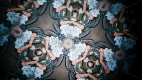 Video - A creative kaleidoscope effect featuring multiple mirrored images of sleeping babies wrapped in blankets