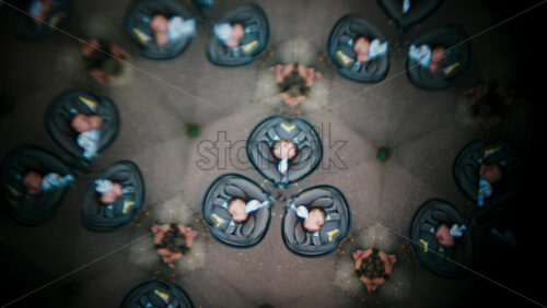 Video - A creative kaleidoscope effect featuring multiple mirrored images of sleeping babies wrapped in blankets