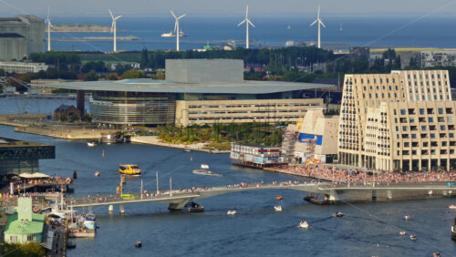 Video – Copenhagen, Denmark – August 7, 2025: Aerial drone view of the Copenhagen Opera House, Inner Harbor Bridge, and Papiroen - Starpik Stock