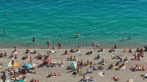 Video – Nice, France – September 5, 2025: Aerial drone view of the famous waterfall at Castle Hill in Nice, surrounded by lush trees and scenic viewpoints - Starpik Stock