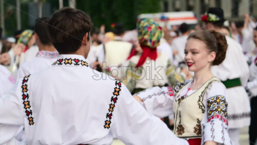 Video - Chisinau, Moldova - July 18, 2025: Traditional Dancers showcase their skills in traditional folk dance during an outdoor festival. Colorful costumes and lively music