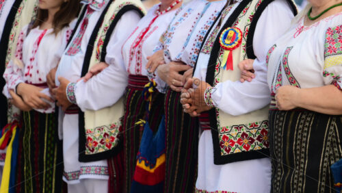 Video - Dancers in traditional Moldavian and Romanian attire perform lively folk dances, displaying colorful costumes