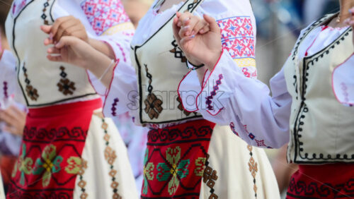 Video - Dancers in traditional Moldavian and Romanian attire perform lively folk dances, displaying colorful costumes and elegant movements