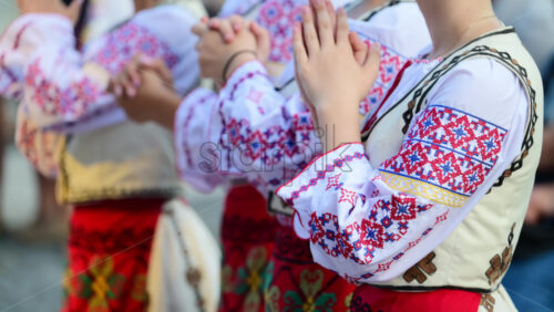 Video - Dancers in traditional Moldavian and Romanian attire perform lively folk dances, displaying colorful costumes and elegant movements