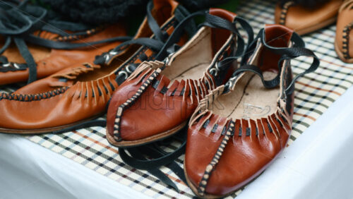 Video - Handmade Moldavian and Romanian Opinca leather shoes at a vibrant artisan market
