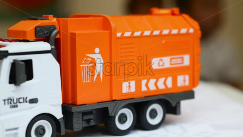 Video - Toy garbage truck, a symbol for learning about waste collection and recycling.