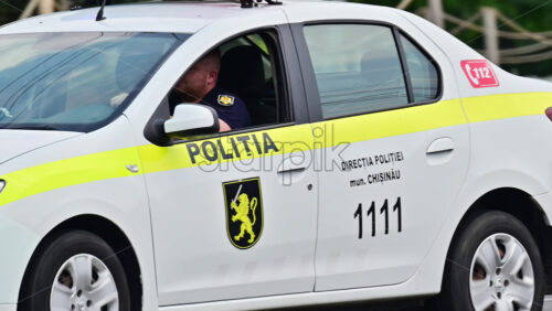 Video - Chisinau, Moldova - July 15, 2025: A police car drives through city center streets with its lights flashing