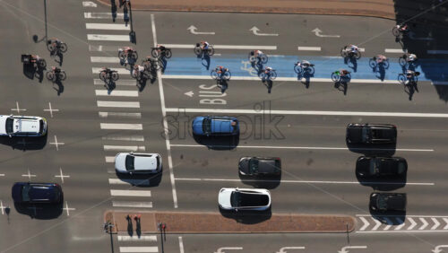 Video - Aerial drone view of a large group of cyclists waiting at a traffic light in Copenhagen, Denmark