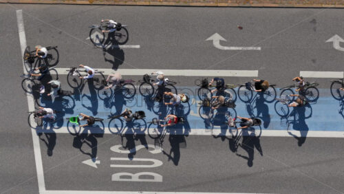 Video - Aerial drone view of a large group of cyclists waiting at a traffic light in Copenhagen, Denmark