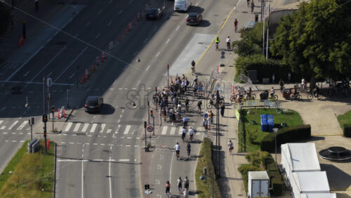 Video - Copenhagen, Denmark - August 6, 2025: Aerial drone view of cars, buses, and bicycles navigating through heavy traffic during rush hour