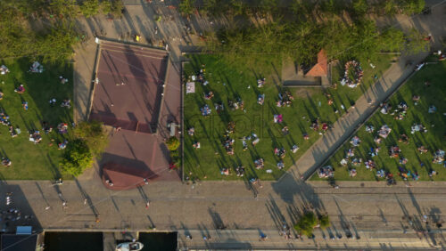 Video - Aerial drone view of locals picnicking on the grass in the Superkilen Park, Norrebro, Copenhagen, Denmark