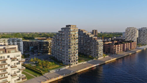 Video - Aerial drone view of modern canalside apartments in the Sluseholmen district in Copenhagen, Denmark
