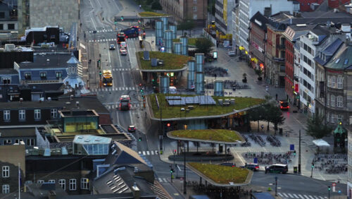 Video - Copenhagen, Denmark - August 7, 2025: Copenhagen, Denmark - August 7, 2025: Aerial drone view of city traffic, cyclists, and modern green-roofed bike pavilions at Norreport Station