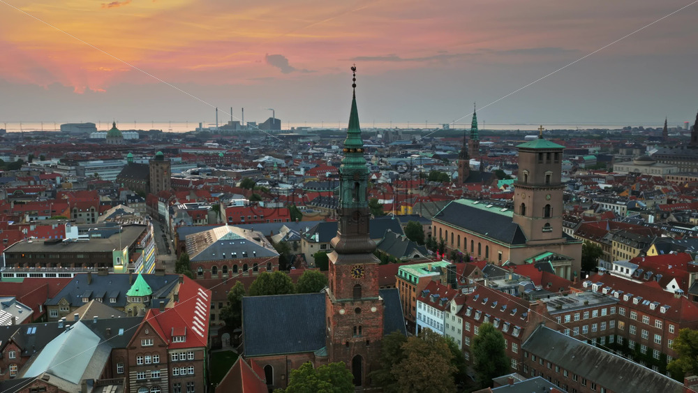 Video - Aerial drone view of St. Peter's Church and Copenhagen skyline at sunrise, Denmark
