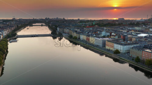 Video - Aerial drone view of The Lakes in Copenhagen, Denmark reflecting colourful dawn sky
